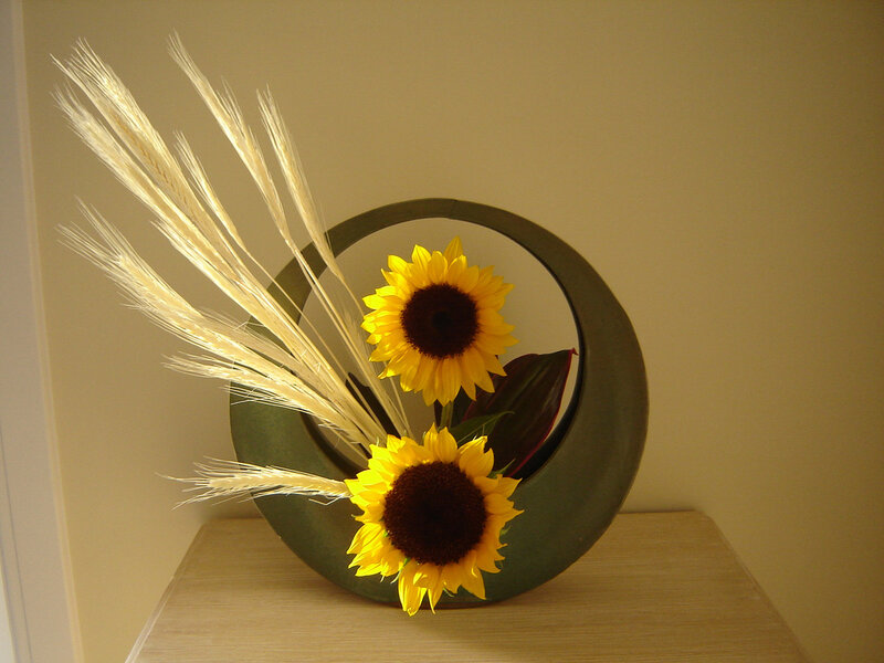 Sunflowers in Circular Vase