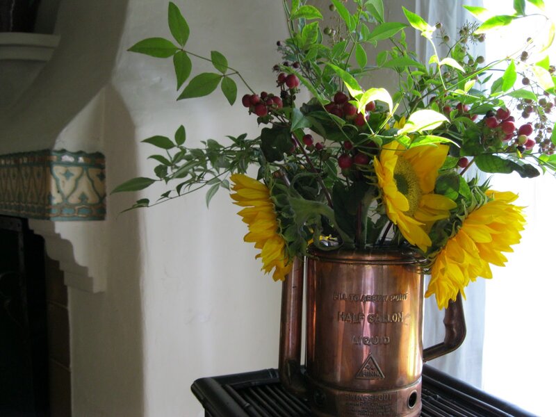 Sunflowers in Copper Pitcher