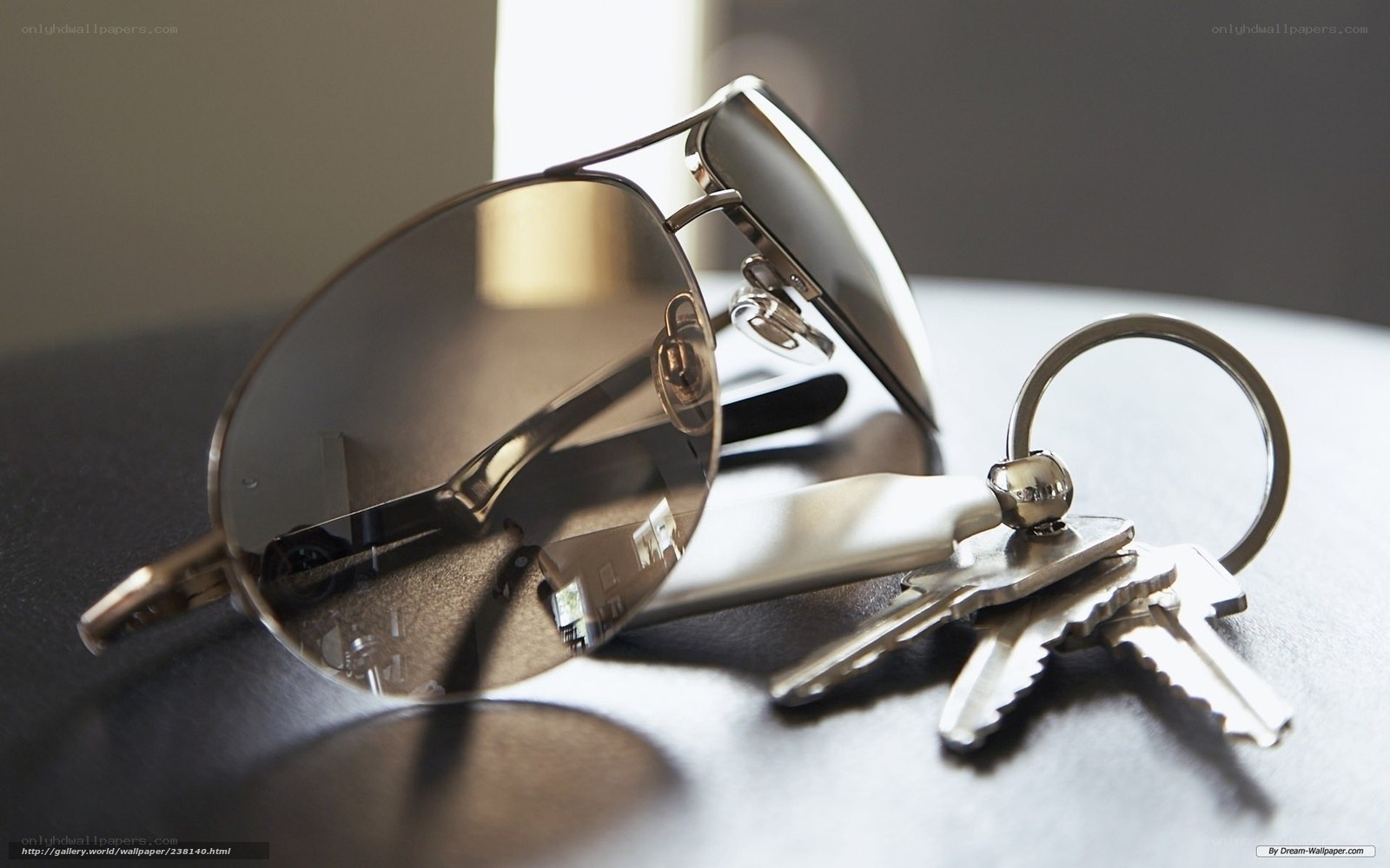 sunglasses and keys on table