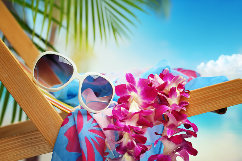 Sunglasses and Lei on Chair