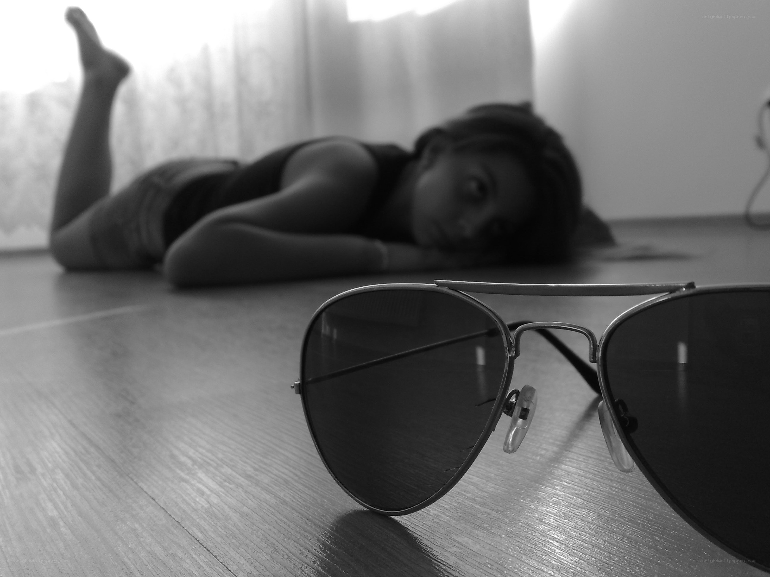 sunglasses and person on floor