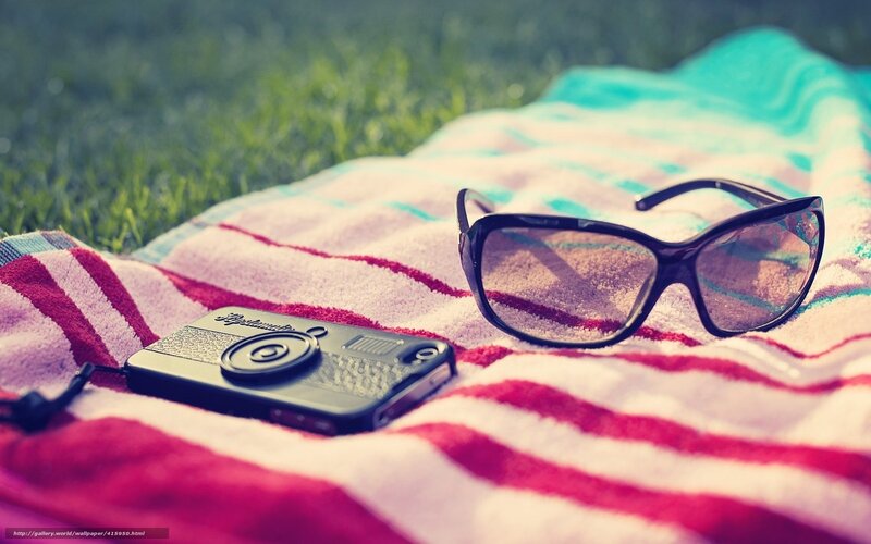 Sunglasses and Phone on Towel