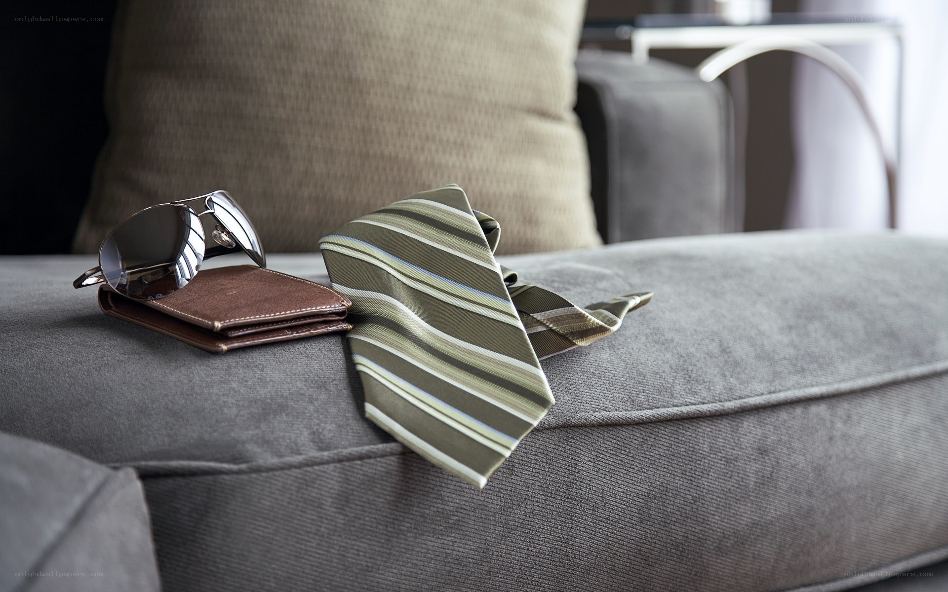sunglasses and tie on couch