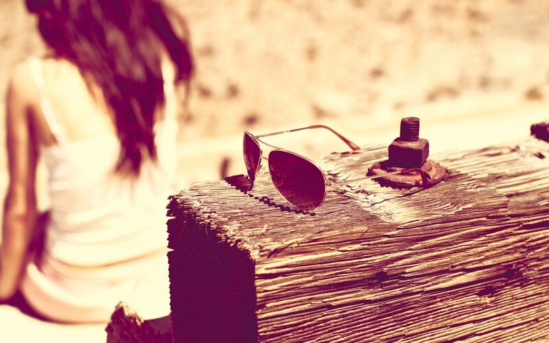 sunglasses on a wooden beam