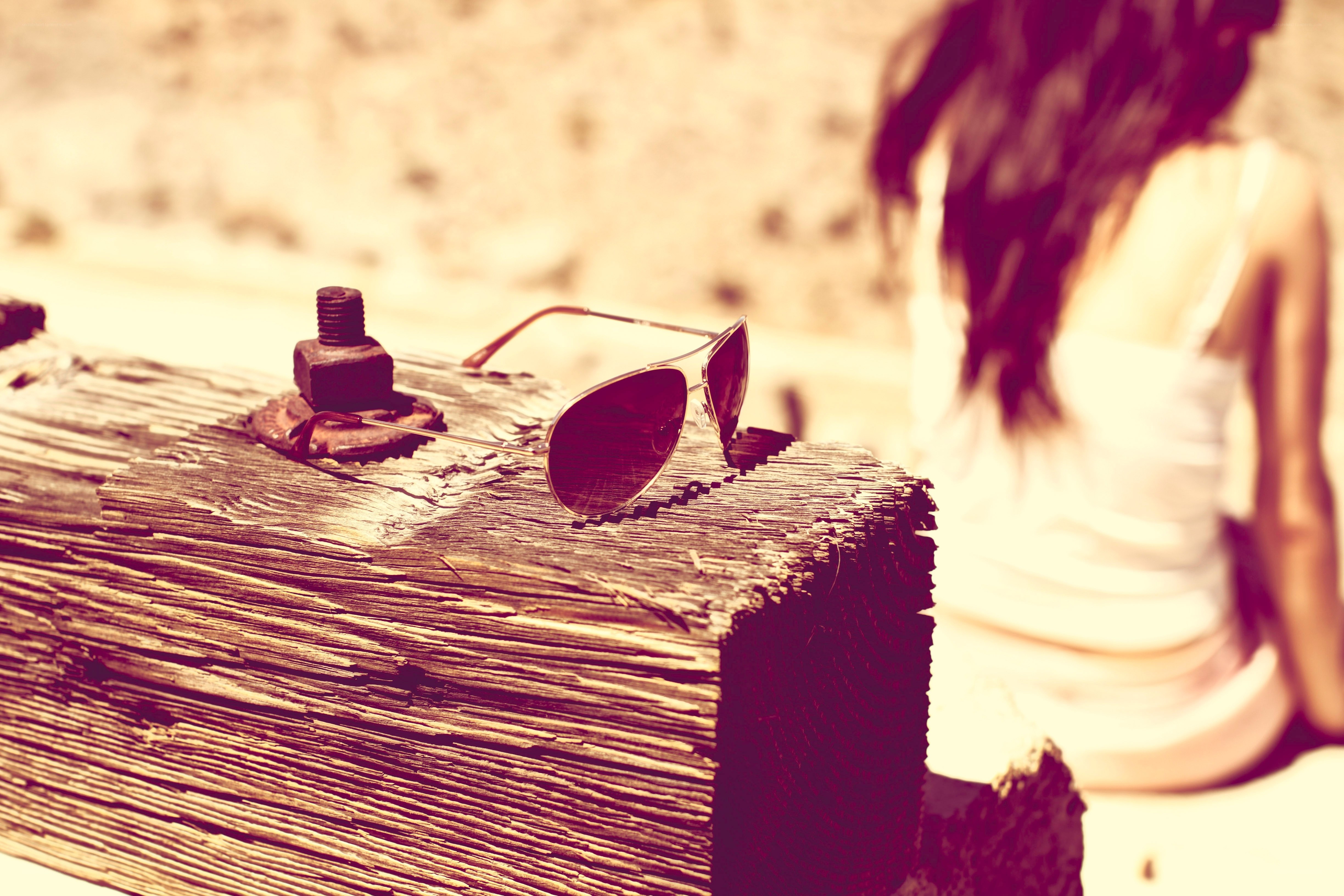 sunglasses on a wooden beam