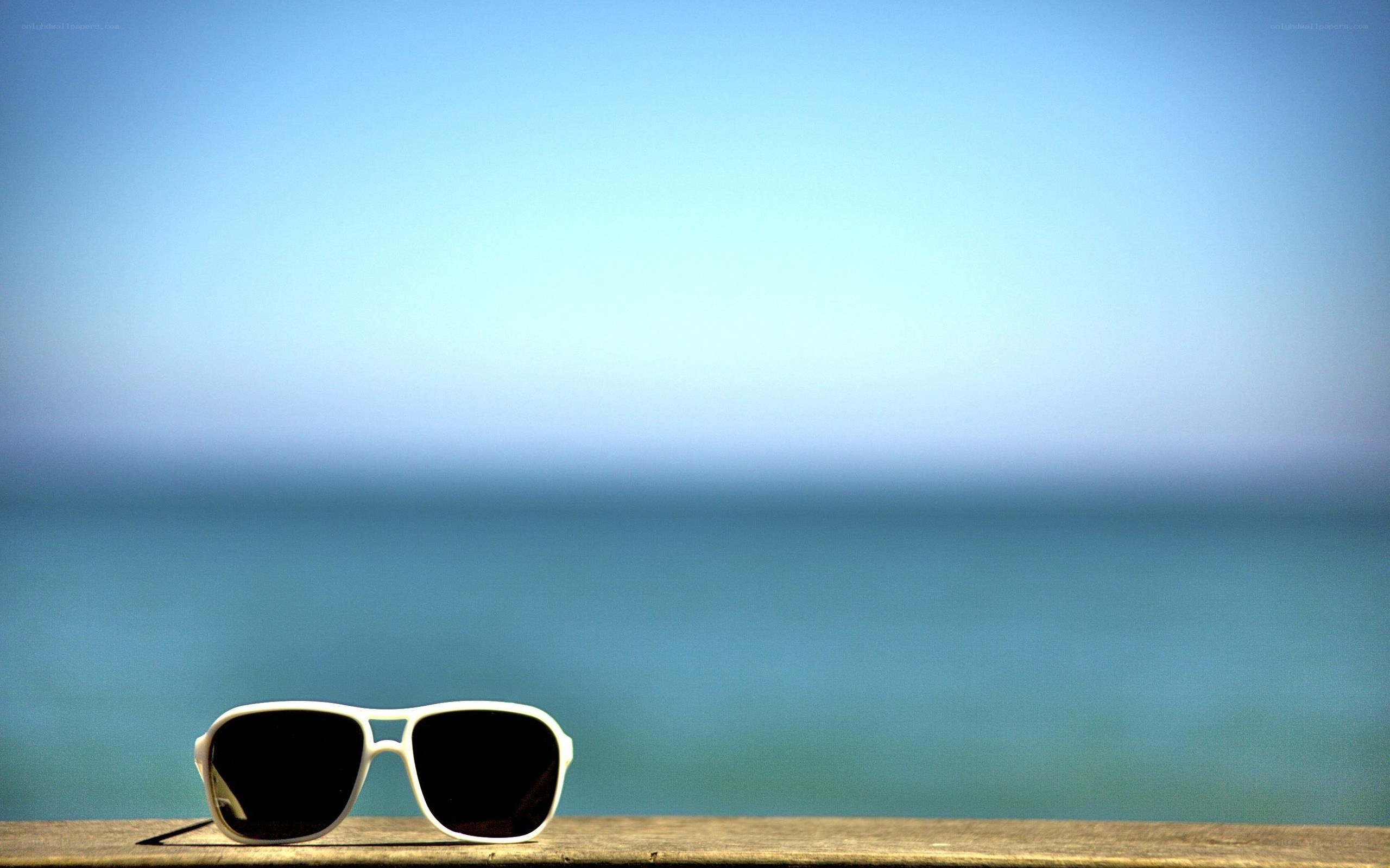 sunglasses on a wooden surface