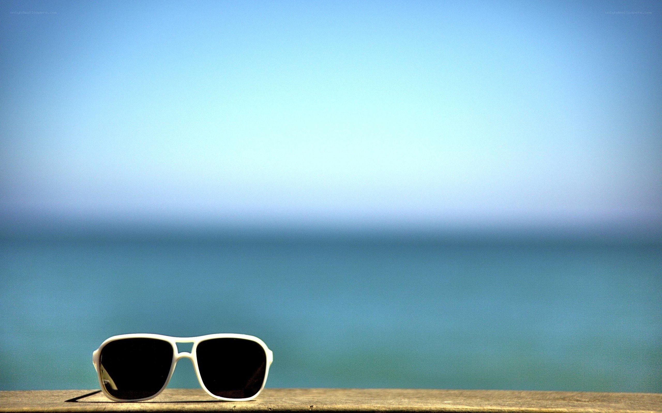 sunglasses on a wooden surface