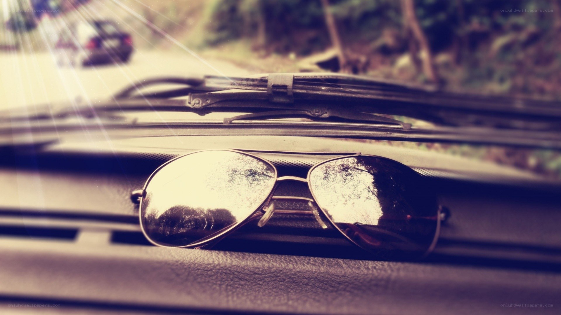 sunglasses on car dashboard