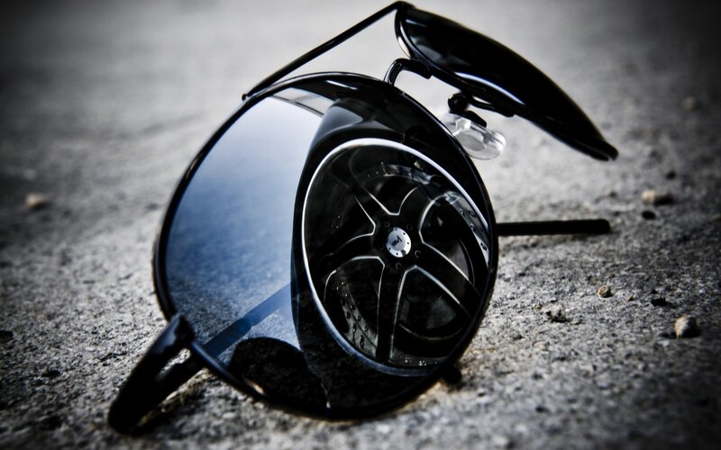 sunglasses on concrete ground