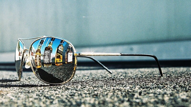 Sunglasses on Pavement — Gray, Dramatic, Afternoon