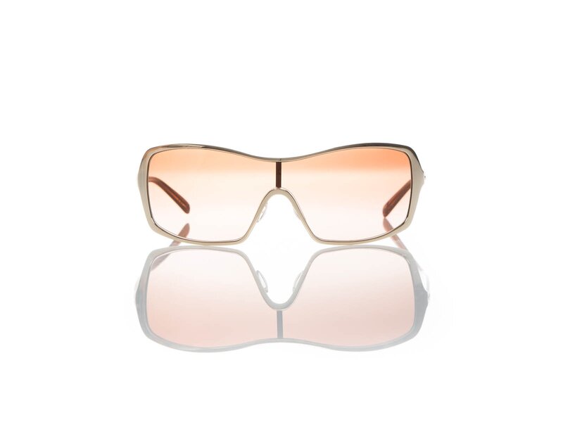 Sunglasses on Reflective Surface — Pink