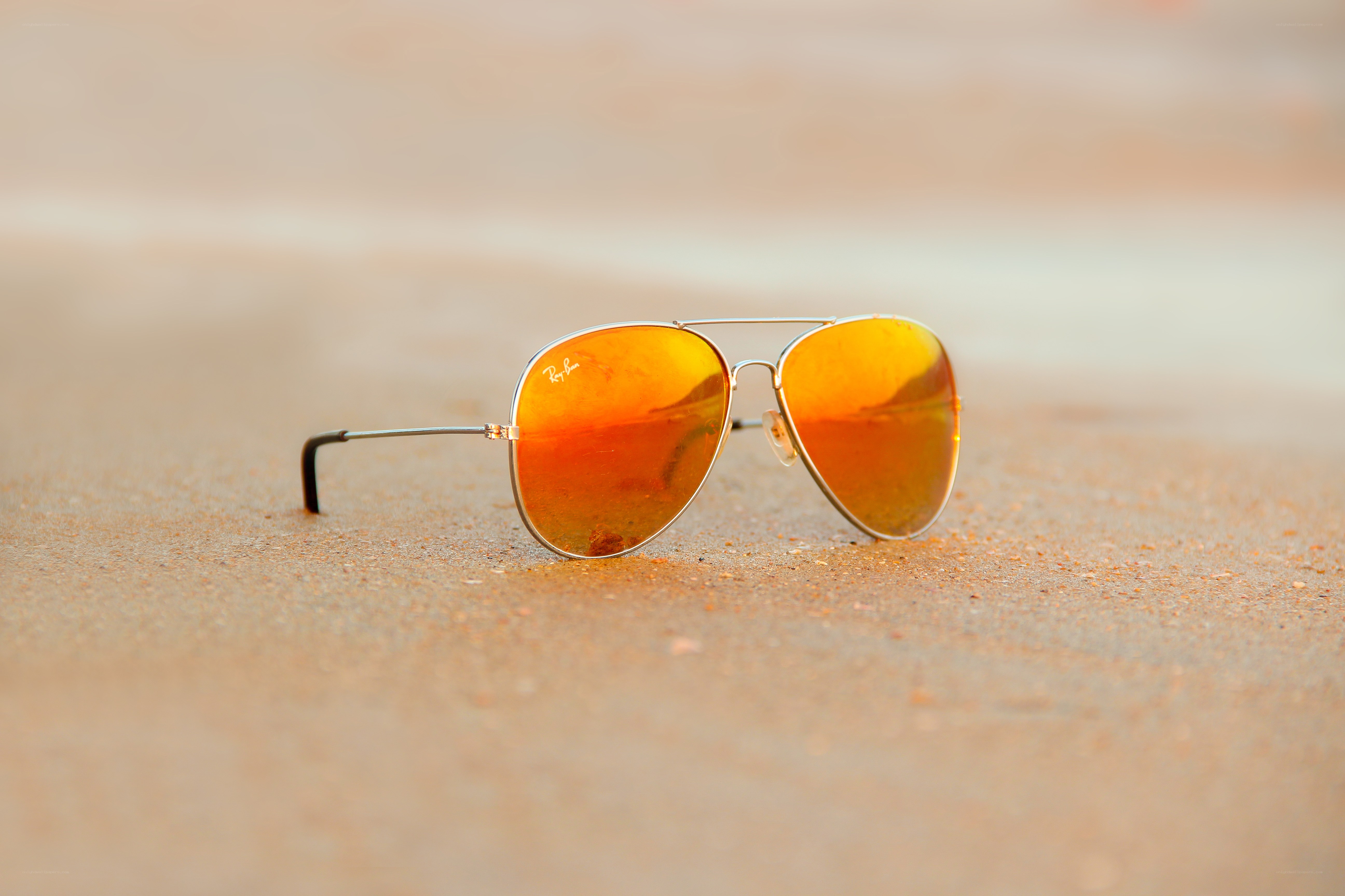 sunglasses on sandy beach