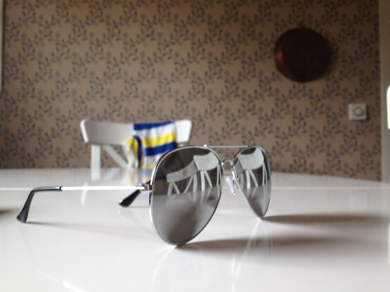 Sunglasses on Table — White