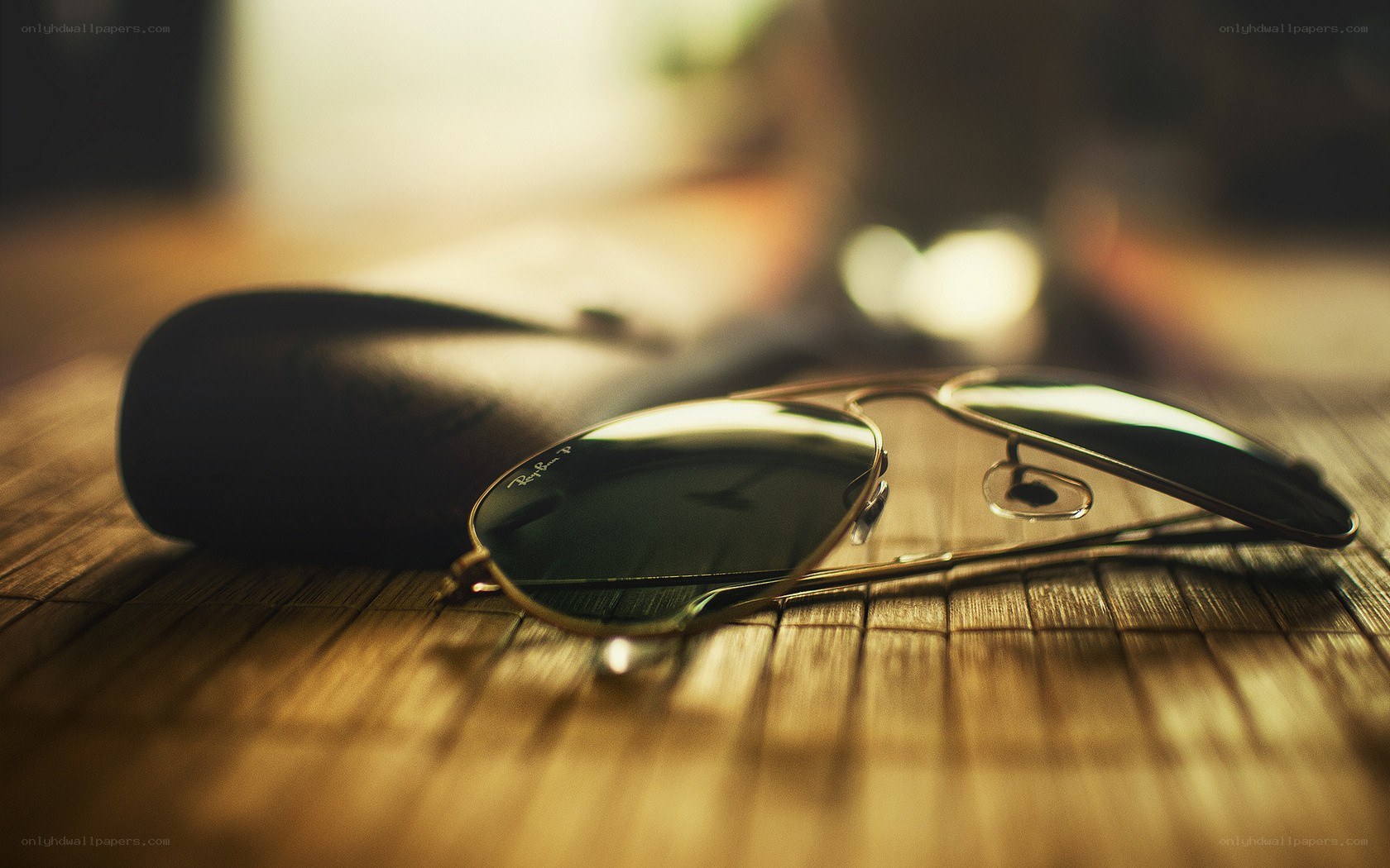 sunglasses on wooden surface