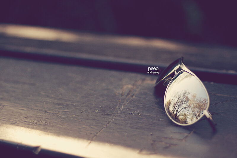 Sunglasses on Wooden Surface — Brown