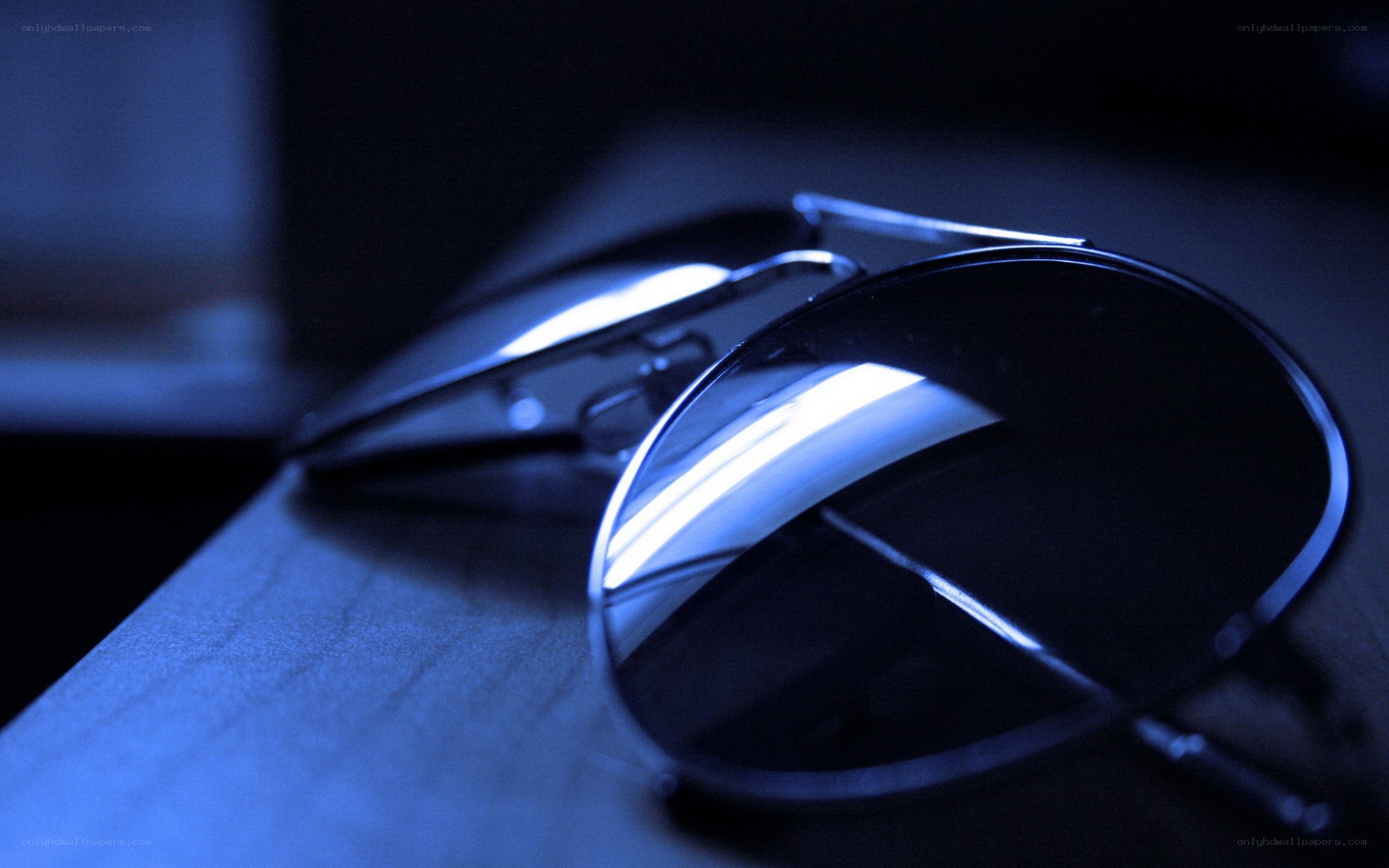 sunglasses on wooden surface