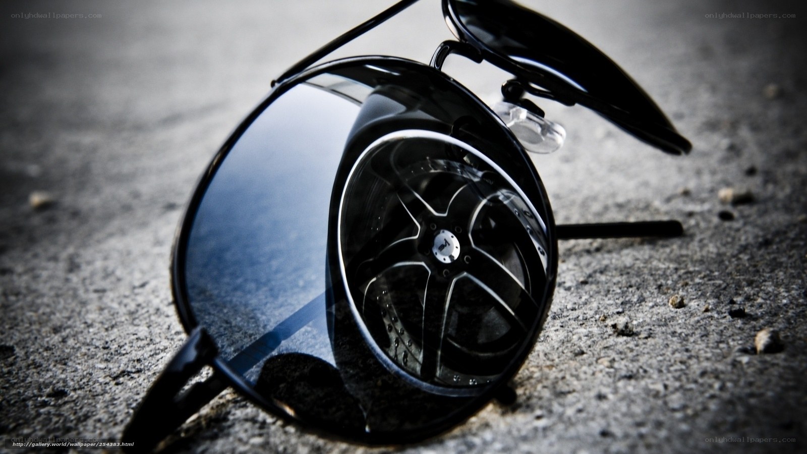 sunglasses reflecting car wheel