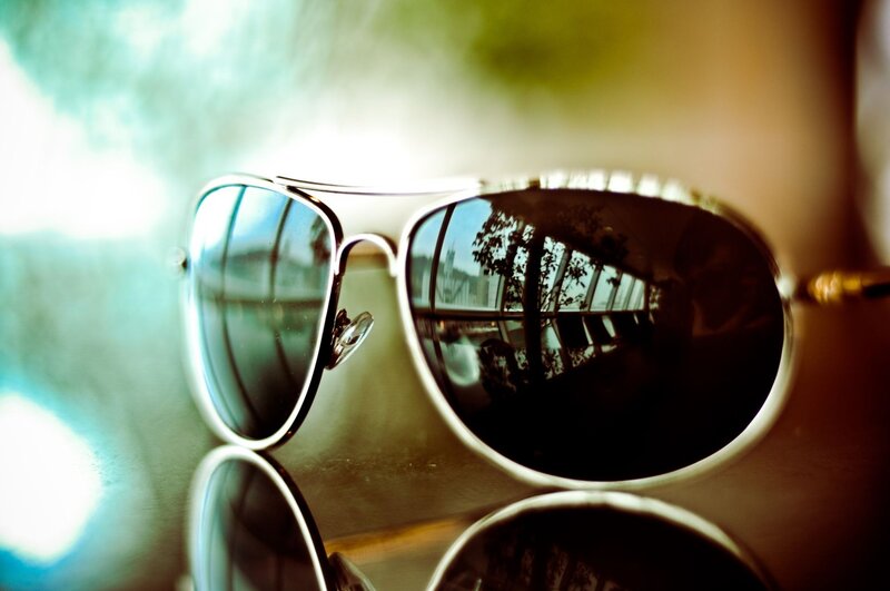 sunglasses reflecting cityscape
