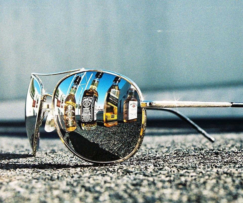 Sunglasses reflecting liquor bottles