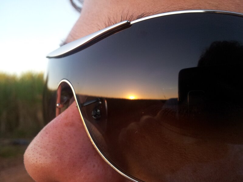 sunglasses reflecting sunset