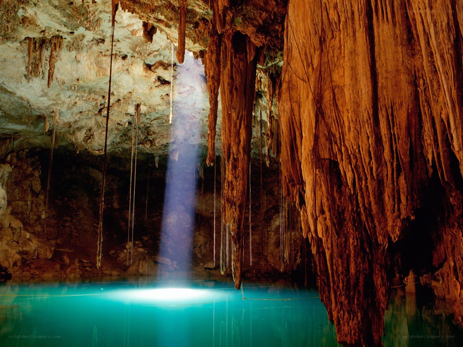 Sunlight beam in cave cenote