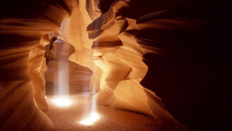 Sunlight beams in a canyon