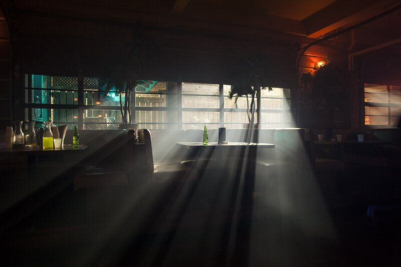 Sunlight beams in empty restaurant