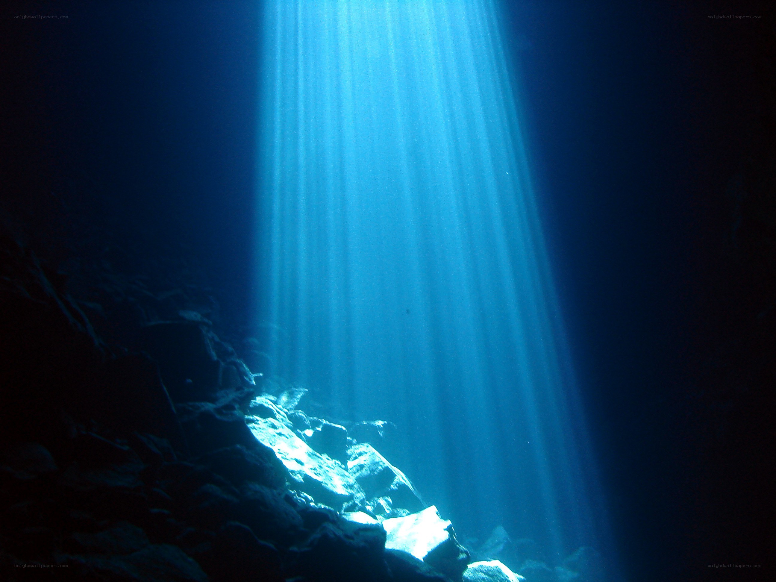 sunlight beams in underwater cave