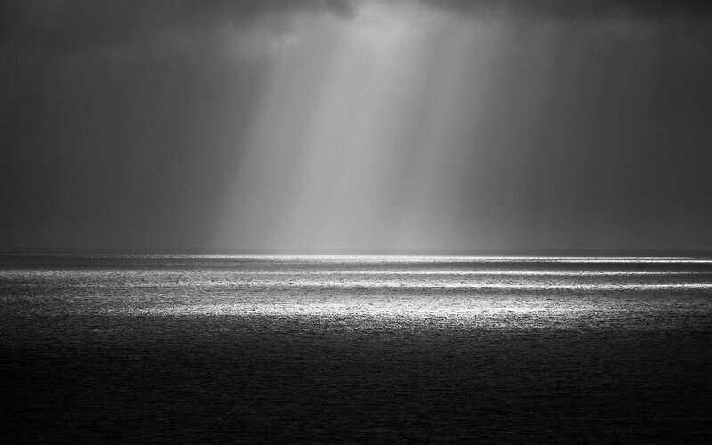 Sunlight Beams over Ocean — Black