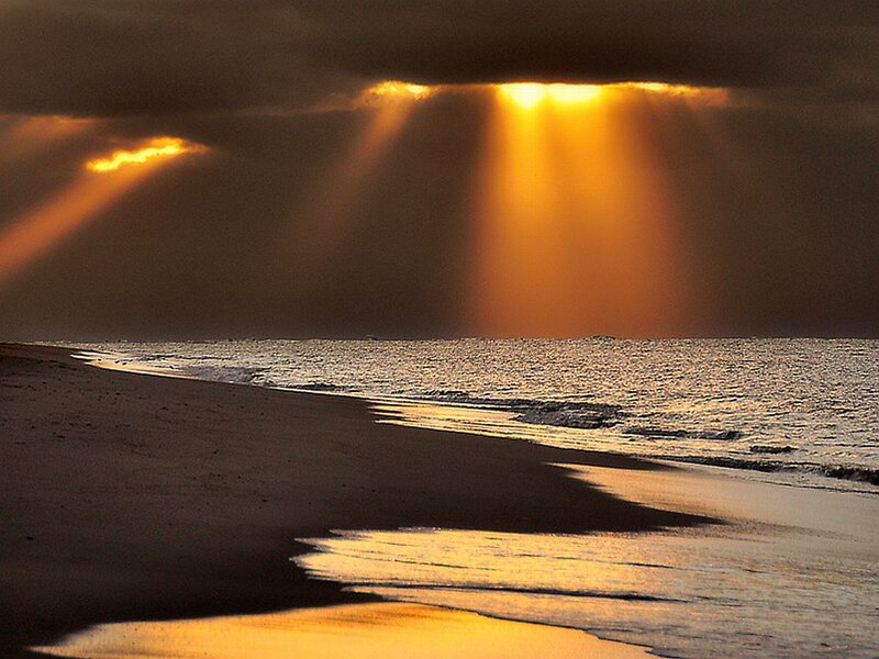 Sunlight Beams over Ocean — Orange