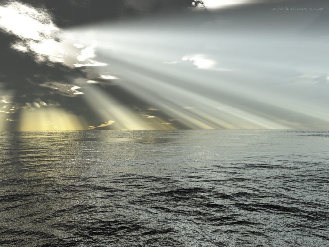 Sunlight beams over the ocean