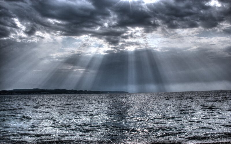 Sunlight beams over the sea