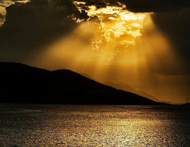 Sunlight beams over water