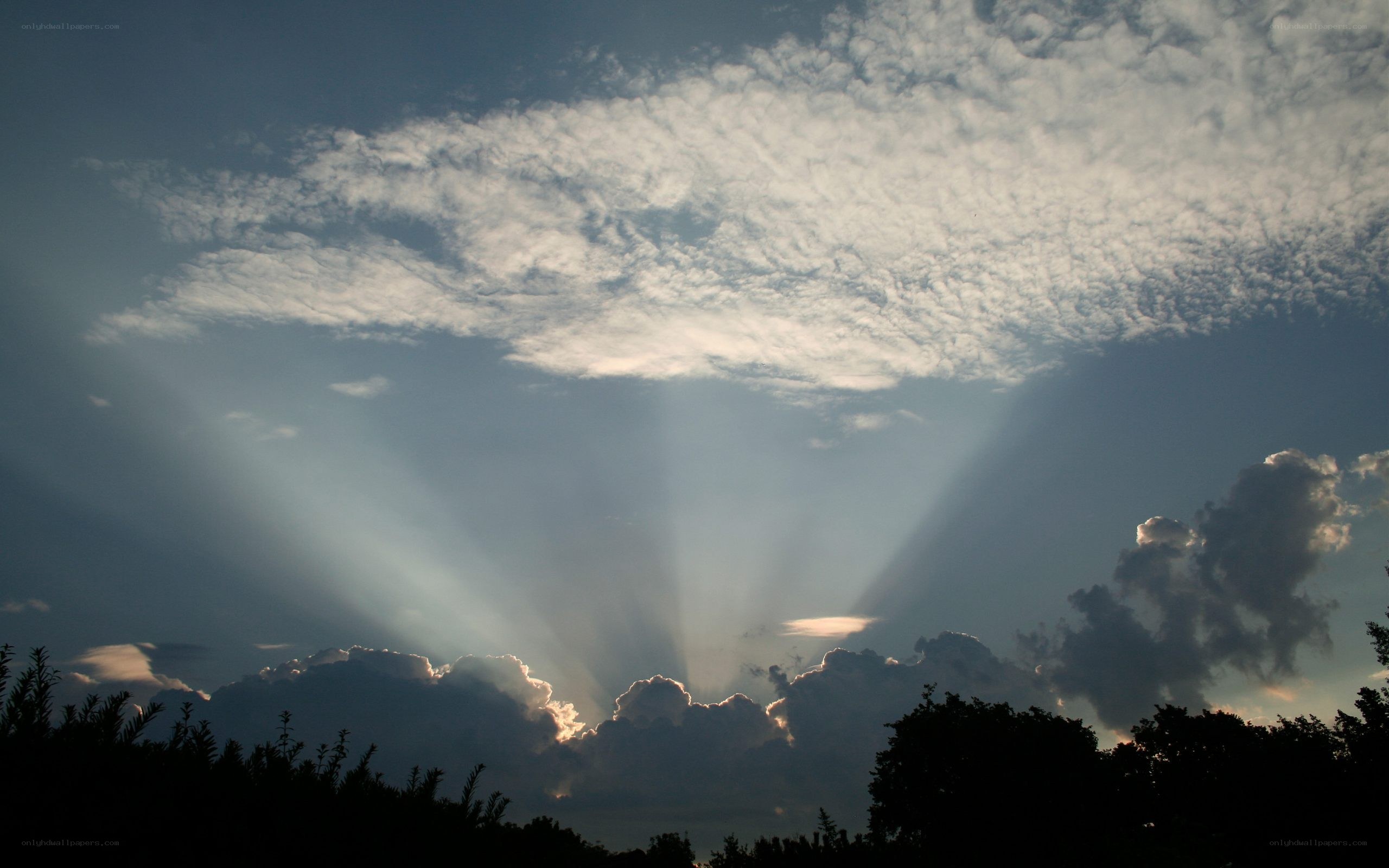 Sunlight beams through clouds