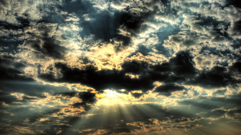 Sunlight breaking through storm clouds