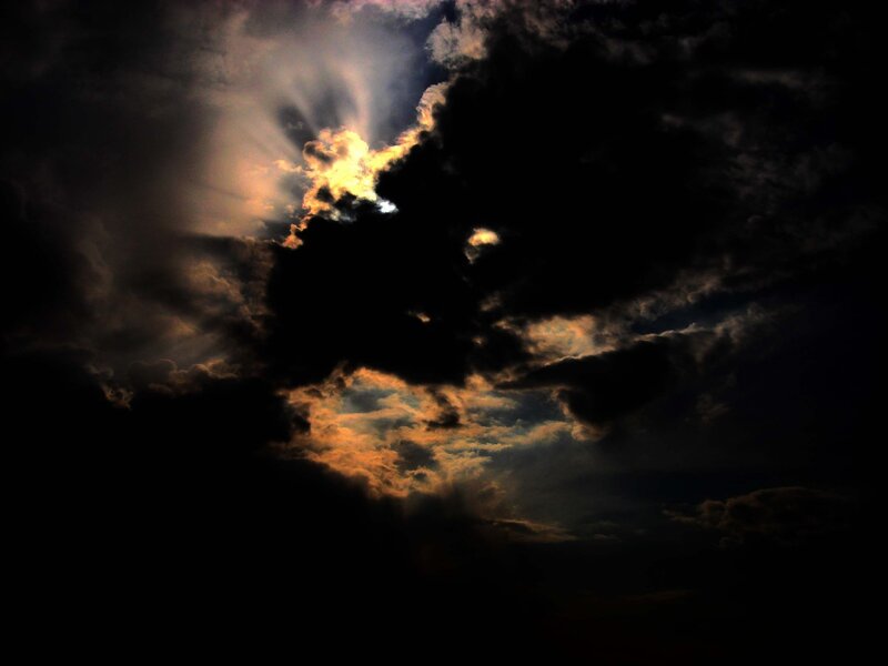 Sunlight breaking through storm clouds