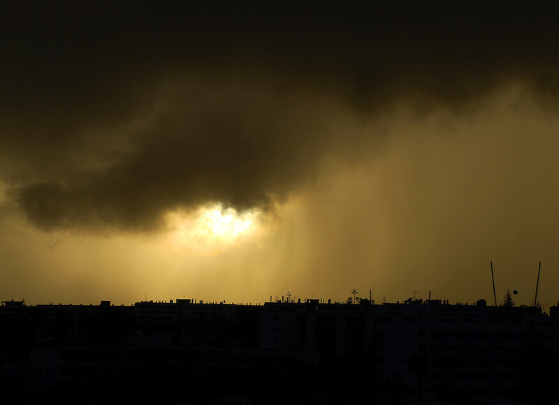 Sunlight breaking through storm clouds