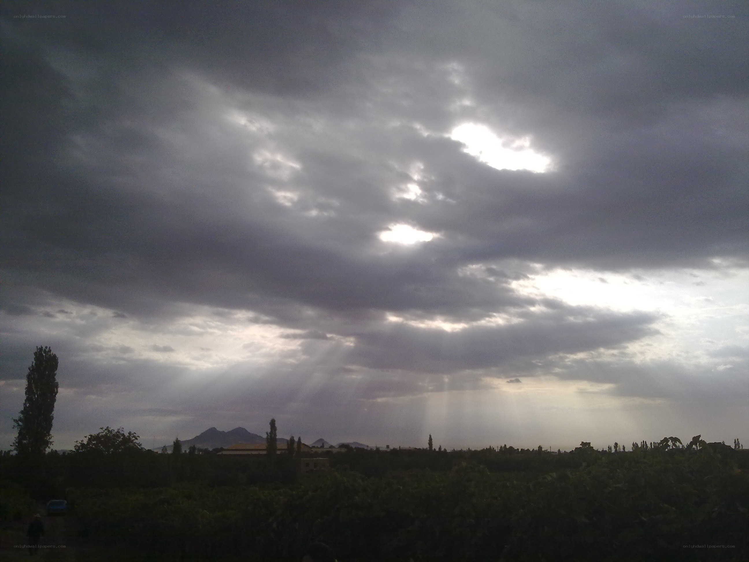 Sunlight breaking through storm clouds