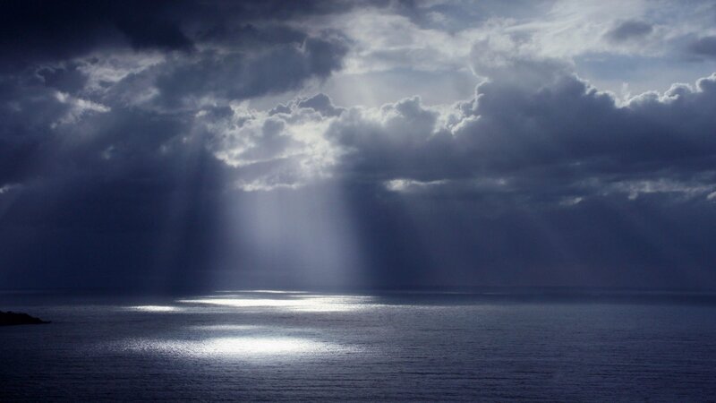 Sunlight breaking through storm clouds