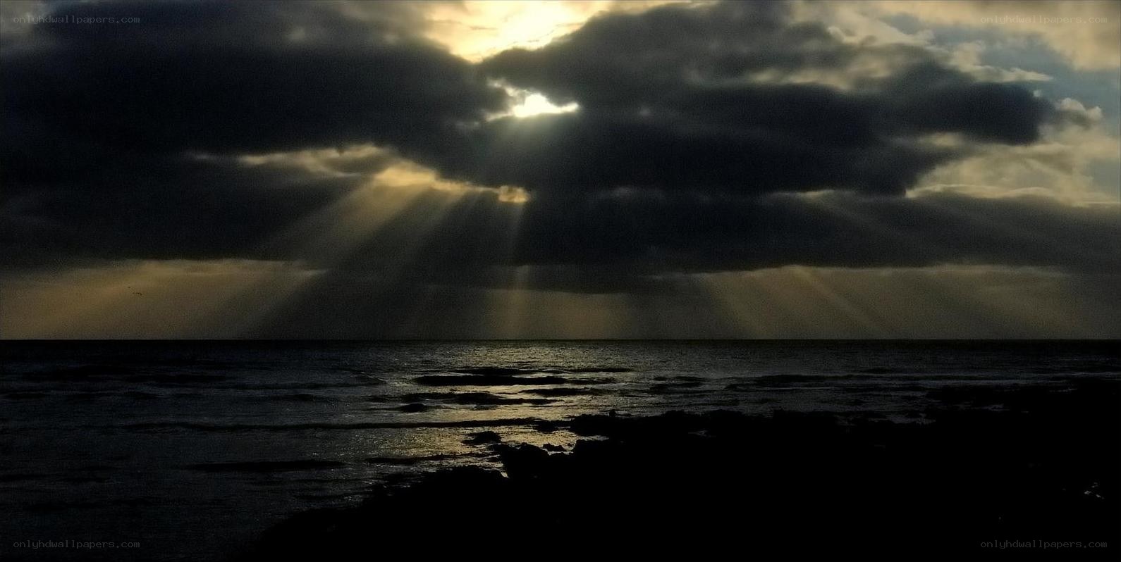 Sunlight breaking through storm clouds