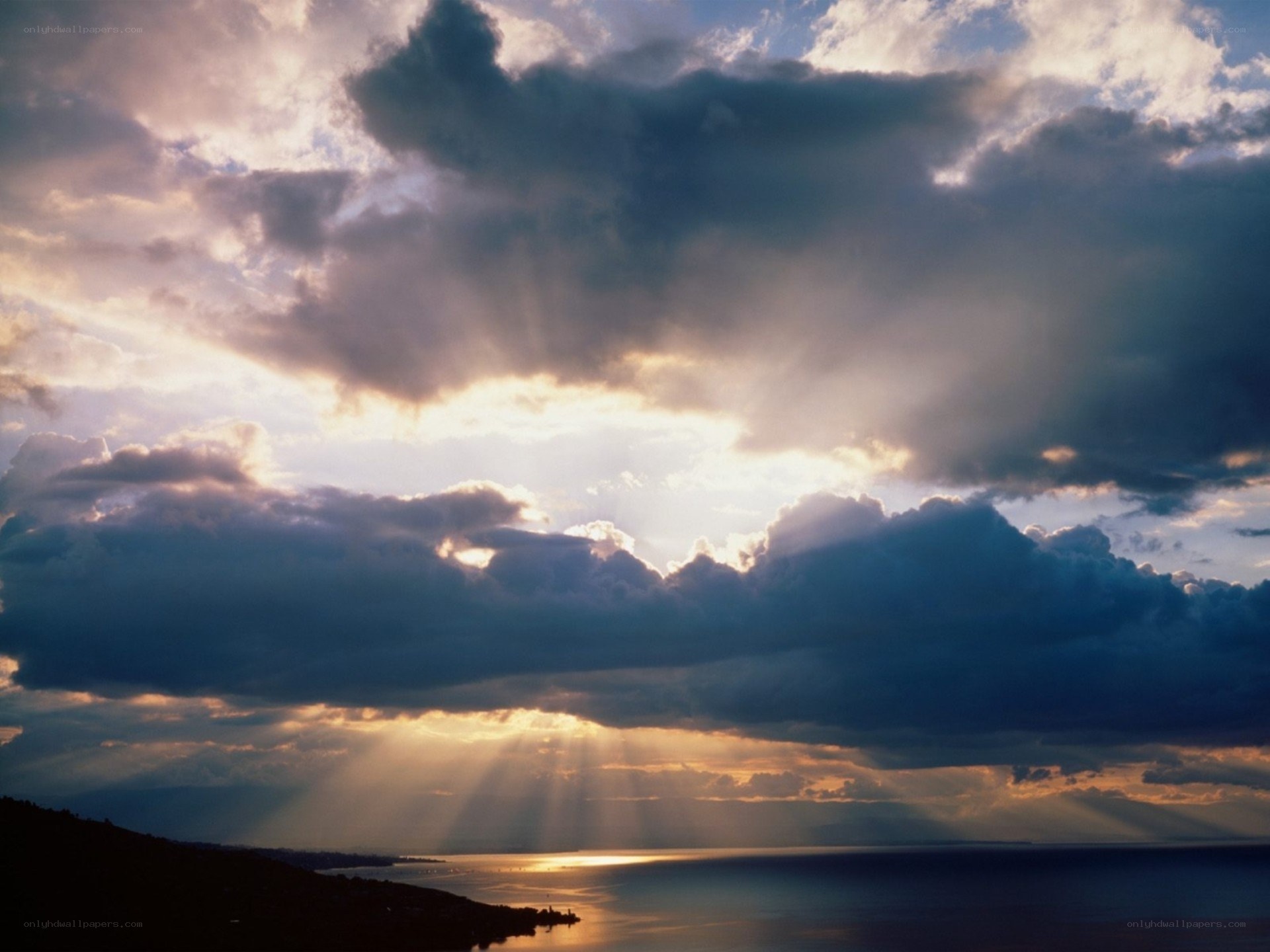 Sunlight breaking through storm clouds