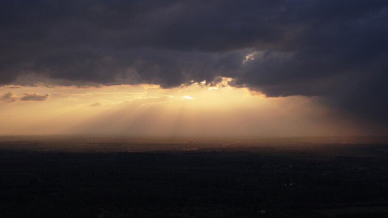 Sunlight breaking through storm clouds