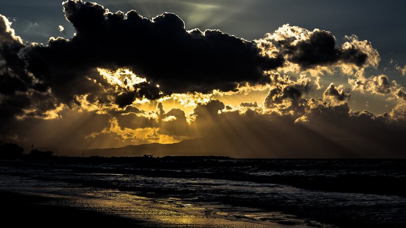Sunlight breaking through storm clouds