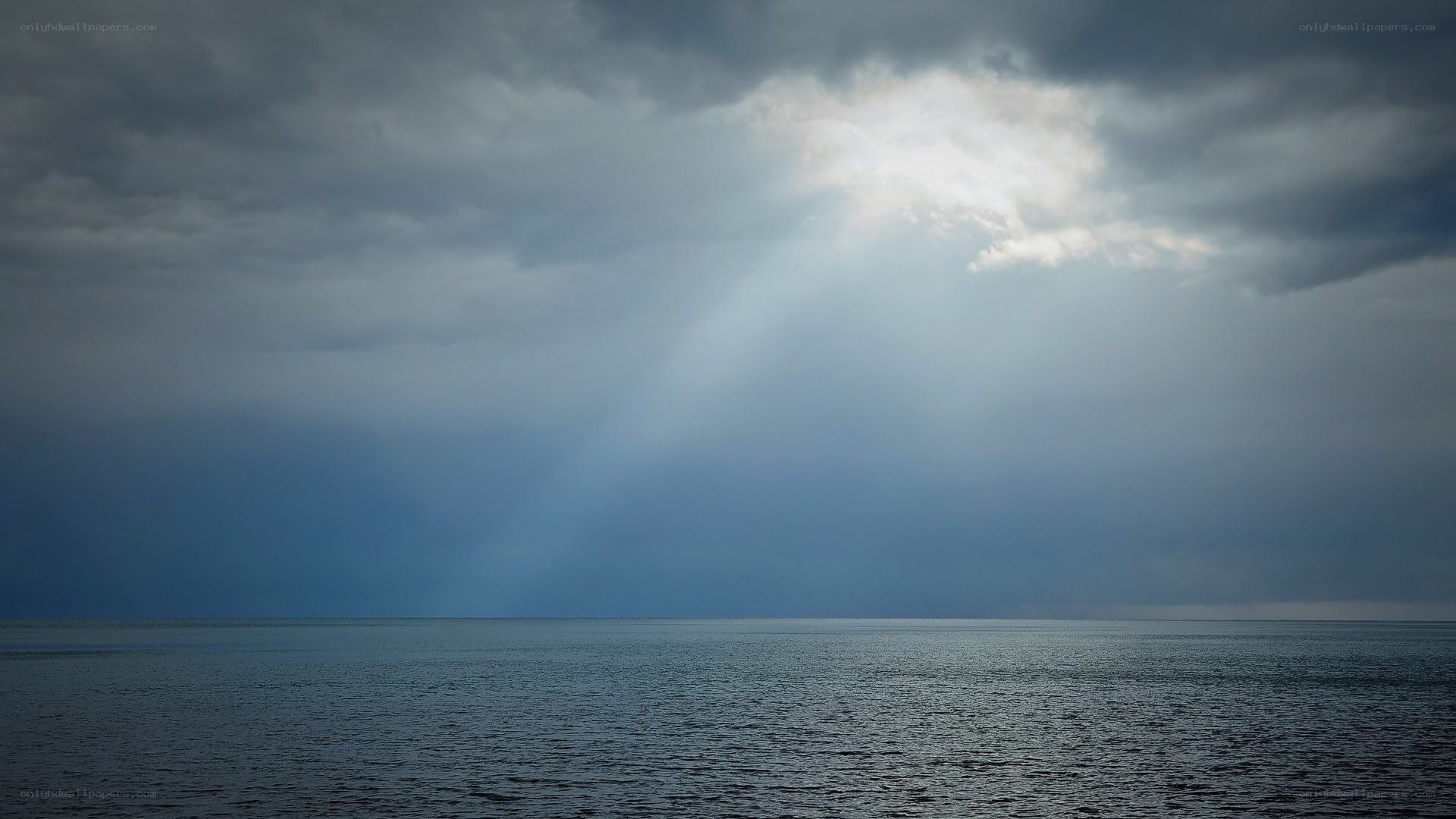 Sunlight breaking through storm clouds