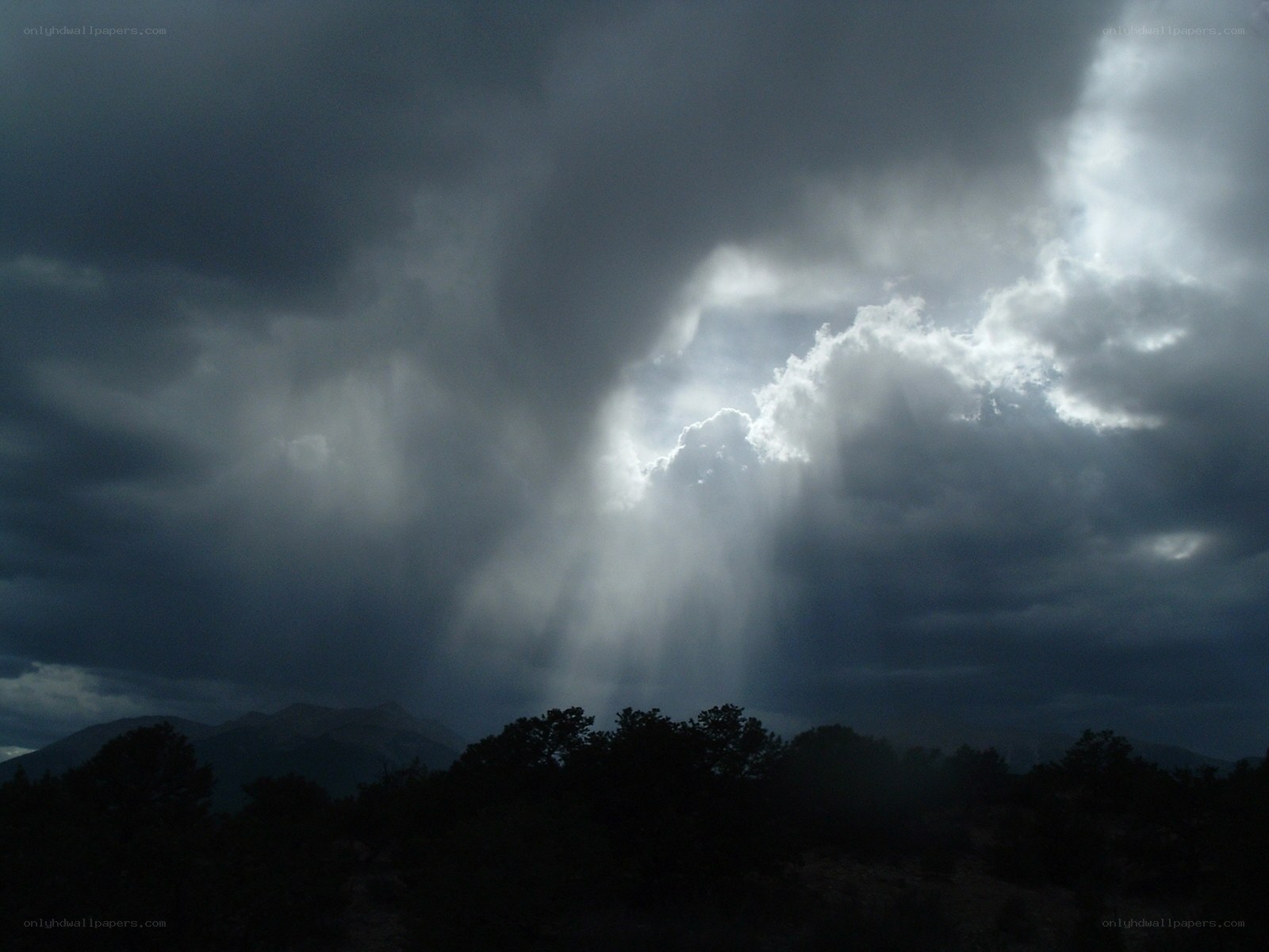 Sunlight breaking through storm clouds