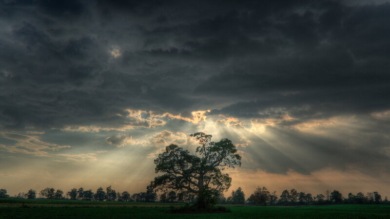 Sunlight breaks through storm clouds