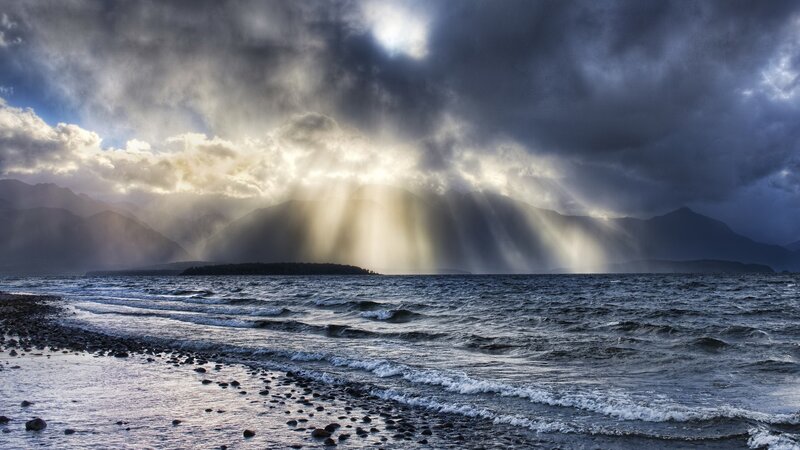 Sunlight breaks through storm clouds
