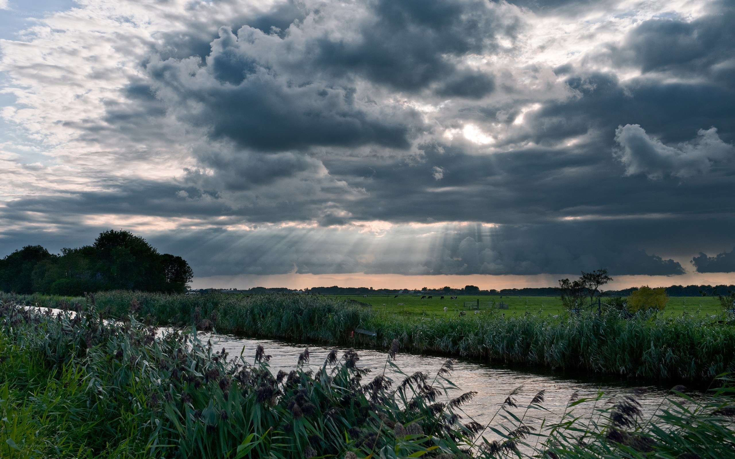 Sunlight breaks through storm clouds
