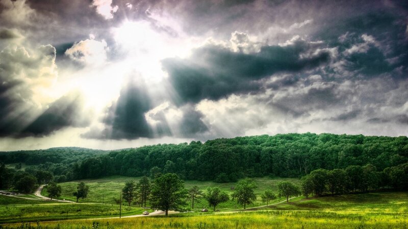Sunlight breaks through storm clouds