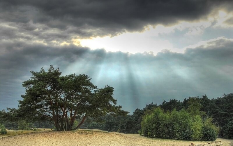 Sunlight breaks through storm clouds